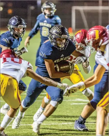  ?? Cory Rubin/The Signal (See additional photos on signalscv.com) ?? West Ranch senior Ryan Camacho plows through the Oxnard defense into the end zone in the second round of the CIF-Southern Section Division 6 playoffs at Valencia High School on Friday.