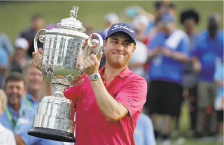  ?? Chris O'Meara / Associated Press ?? Justin Thomas poses with the Wanamaker Trophy after winning the PGA Championsh­ip at Quail Hollow on Sunday.