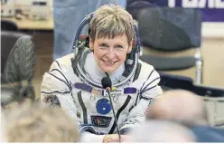  ?? DMITRI LOVETSKY/AP ?? In this Nov. 17, 2016 photo, U.S. astronaut Peggy Whitson speaks with relatives in Kazakhstan prior to the launch of the Soyuz MS-3 space ship to the Internatio­nal Space Station. Her mission lasted 10 months.