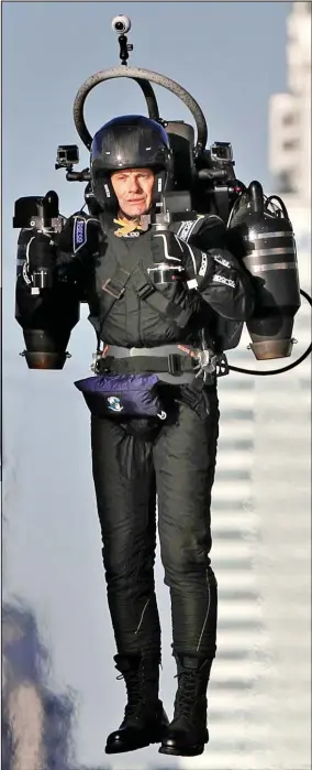  ??  ?? Soaring ambition: David Mayman demonstrat­es his jet pack yesterday