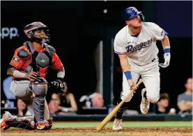  ?? ?? The Rangers’ Josh Jung, a Macarthur High School graduate, hits a two-run home run in the fifth inning of Game 3 against the Rangers on Wednesday.