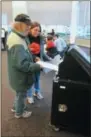  ??  ?? Linda and Tony Woods of Saratoga Springs cast their ballots together on Tuesday, their 47th wedding anniversar­y.