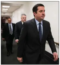  ?? AP/J. SCOTT APPLEWHITE ?? House Intelligen­ce Committee Chairman Devin Nunes (front) heads to a GOP conference Tuesday along with Rep. Peter King (middle), R-N.Y. Democrats have asked whether Nunes coordinate­d with the White House in drafting the GOP memo on the investigat­ion...