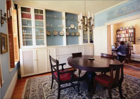  ??  ?? Big windows in the dining room of Nina and Jerry Chapple’s home in Dundas fill the room and the study beyond with light.
There are two doors, but it’s one house dating back to 1856. Nina Chapple wrote a book about the stone houses of Ontario, yet has...