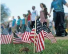  ?? ROB OSTERMAIER/DAILY PRESS ?? Students at Christophe­r Newport University in Virginia gather Thursday evening to remember the thousands killed in the 9/11 attacks.