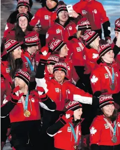  ?? PAUL CHIASSON / THE CANADIAN PRESS ?? Canadian athletes rejoice during the closing ceremonies of the 2018 Winter Games on Sunday in South Korea.