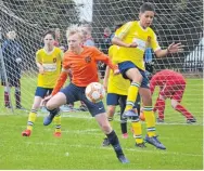  ??  ?? Fairmuir U/14s (orange) ran out winners of the U/14 section — here they take on Ferry Athletic.