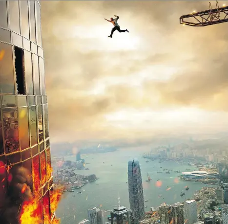  ?? UNIVERSAL ?? Dwayne Johnson takes a leap of faith in his almost hysterical commitment to being a good husband, father and hero in Skyscraper.