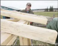  ??  ?? Executive Director Barry Rothfuss takes on the roll of carpenter to help build extra shelter space for animals the institute will shelter for the winter.