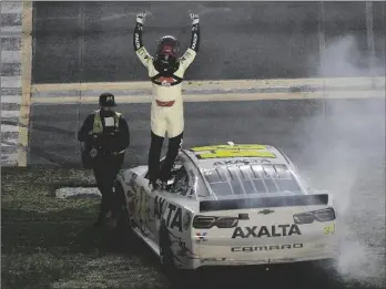  ?? AP PHOTO/CHRIS O’MEARA ?? William Byron celebrates after winning the NASCAR Daytona 500 auto race on Monday at Daytona Internatio­nal Speedway in Daytona Beach, Fla.