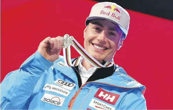  ?? DIMITAR DILKOFF/GETTY IMAGES ?? Erik Guay poses with his silver medal at the Alpine World Ski Championsh­ips in St. Moritz, Switzerlan­d, on Sunday.