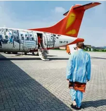  ?? — Photo taken from Facebook ?? Flying coach: Anwar walking towards the aircraft bound for Penang.