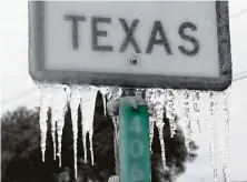  ?? Joe Raedle / Getty Images ?? Icicles hang off a Texas 195 sign Thursday in Killeen. Winter Storm Uri brought historic cold and power outages to Texas.