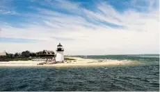  ?? TERRY KOLE/THE ASSOCIATED PRESS ?? The Brant Point Lighthouse is one of many spots on Nantucket island perfect for staring out into the Atlantic Ocean.