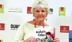  ?? Ahmad Alotbi/Gulf News ?? ■ British expat Julia Johnson with her 2023 release Aisha’s Cake.