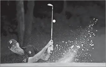  ?? JOHN BAZEMORE/AP PHOTO ?? Matt Kuchar hits from the bunker on the 12th hole during a practice round at the PGA Championsh­ip in Charlottle, N.C. Kuchar, the runner-up at the British Open, will try to win his first major as the PGA begins today.