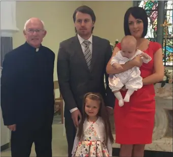  ??  ?? Bradley John Kelly from Ballyeaski­n, Templeboy at his recent baptism pictured with his parents Derek and Maeve, big sister Natalie and Fr Tommy Towey.