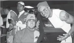  ?? AP PHOTO BY BOB GENTRY ?? In this 2008 file photo, Gentry’s son Tyson, center, and former Ohio State safety Kurt Coleman pose with the Big Ten championsh­ip trophy in the Ohio State locker room in Columbus, Ohio.