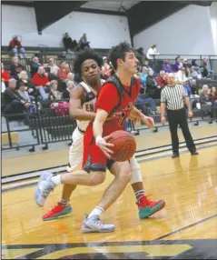  ?? The Sentinel-Record/James Leigh ?? DRIVER’S SEAT: Cutter Morning Star junior guard Ryan Brown (11) drives to the basket against England junior guard Kevante Davis Friday during the Eagles’ 69-47 loss in the 2A-5 South district tournament final at Carlisle.