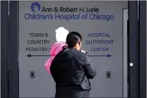  ?? NAM Y. HUH — THE ASSOCIATED PRESS ?? A person is outside an Illinois hospital. A cyberattac­k on the renowned children’s hospital in Chicago has left some parents scrambling.