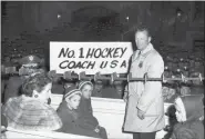  ?? ASSOCIATED PRESS FILE ?? In this Feb. 29, 1960, photo, U.S. Olympic hockey coach Jack Riley is welcomed back to the U.S. Military Academy at West Point, N.Y.