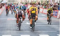  ??  ?? Dylan Groenewege­n celebrates after winning stage four of the UAE tour.