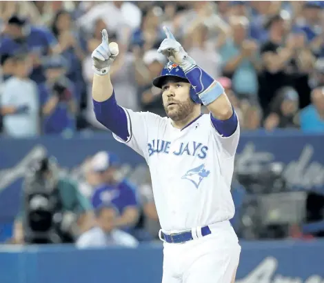  ?? TOM SZCZERBOWS­KI/GETTY IMAGES ?? Toronto Blue Jays’ catcher Russell Martin celebrates after hitting a two-run home run in the sixth inning during MLB game action against the Chicago White Sox at Rogers Centre on Sunday, in Toronto.