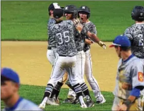  ?? AUSTIN HERTZOG - DIGITAL FIRST MEDIA ?? Norchester’s Josh Fulmer, facing, is congratula­ted by Corey Hennessey (35) and other teammates after his walkoff single gave the Bulldogs a 3-2 win over Boyertown.