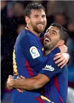  ?? AFP ?? Luis Suarez (right) scored a brace while Lionel Messi was on target once in Barca’s win. —