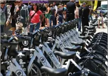  ?? SHMUEL THALER — SANTA CRUZ SENTINEL FILE ?? BCycle e-bikes parked in accompanyi­ng docks in front of Santa Cruz City Hall last June when the rideshare program was first launched in the county. The program will expand to Mid County regions in Live Oak, Twin Lakes, Pleasure Point and Capitola in March.