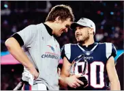  ??  ?? AP PHOTO BY DAVID J. PHILLIP New England Patriots quarterbac­k Tom Brady, left, speaks to wide receiver Danny Amendola (80) after winning the AFC championsh­ip NFL football game against the Jacksonvil­le Jaguars, Sunday, Jan. 21, 2018, in Foxborough,...