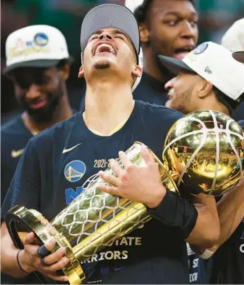  ?? ELSA/GETTY ?? Warriors’ Jordan Poole celebrates after the Warriors won the championsh­ip on Thursday in Boston.