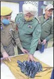  ?? PTI PHOTO ?? J&K Police displaying the recovered arms.