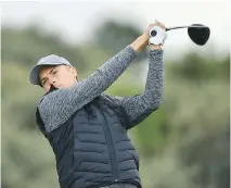  ?? DAN MULLAN/GETTY IMAGES ?? Jordan Spieth tees off on the second hole Thursday. He shares the lead, despite not playing competitiv­ely in weeks.
