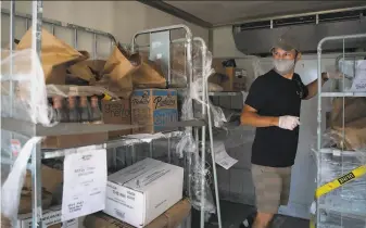  ?? Sarahbeth Maney / The Chronicle ?? Byron Eppler, a customer success specialist with Cheetah, prepares orders for pickup in Pleasanton. Cheetah has switched from supplying restaurant­s to selling directly to consumers.