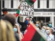  ?? JIM NOELKER / STAFF ?? Protesters assemble near the Federal Building in downtown Dayton recently with the idea of ending racial injustice, which undeniably is part of a public health crisis in America.