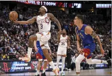  ?? AARON ONTIVEROZ — THE DENVER POST ?? The Suns’ Bradley Beal, left, drives past the Nuggets’ Michael Porter Jr. in the Suns’ 117-107 win at Ball Arena in Denver on March 5.