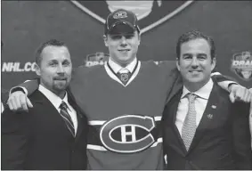  ?? BRUCE BENNETT/ GETTY IMAGES ?? Habs pick Nathan Beaulieu is learning the pro game with the Hamilton Bulldogs. He signed in St. Paul, Minn., in 2011 with Trevor Timmins, left, and Canadiens owner Geoff Molson.