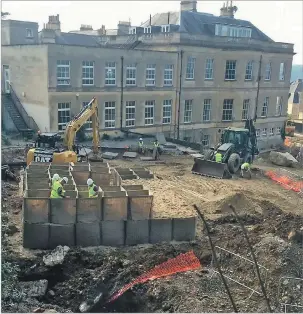  ??  ?? The bomb disposal team construct a massive barrier from 250 tons of sand