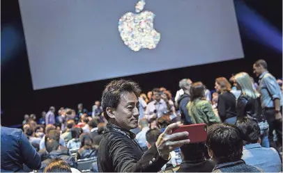  ?? ANDREW BURTON, GETTY IMAGES ?? A man takes a selfie at Apple’s Worldwide Developers Conference last year in San Francisco. This year’s conference, held in San Jose for the first time since 2002, starts Monday and ends June 9.