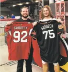  ?? Courtesy Gardeck family ?? A’s pitcher Ian Gardeck (left) and his brother, Dennis, hold each other’s jerseys. Dennis plays in the NFL.