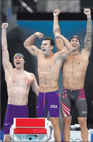  ?? Matthias Schrader The Associated Press ?? Bowe Becker, from left, Blake Pieroni and Caeleb Dressel celebrate after teaming with Zach Apple for a gold medal in the 4x100 relay.