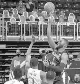  ?? COURTESY MIAMI ATHLETICS ?? Florida State forward RaiQuan Gray shoots a floater over the Miami defense in an ACC game at Watsco Center on Wednesday.