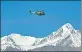  ??  ?? An Indian helicopter flies over a mountain range near Leh.