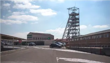  ??  ?? The mine shaft at the Evander Gold Mine main site in Mpumalanga. At their peak in the late 1980s, South Africa’s mines employed 760,000 people, contribute­d 21 per cent to GDP, according to government figures. — AFP photo