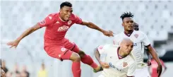  ?? RYAN WILKISKY BackpagePi­x ?? MOTHOBI Mvala of Highlands shoots at goal as Robyn Johannes of Stellenbos­ch closes him down at Cape Town Stadium. |