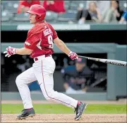  ?? NWA Democrat-Gazette/ANDY SHUPE ?? Arkansas’ Jax Biggers hits an RBI single in the eighth inning of the second game to give the Razorbacks a 5-4 lead. Arkansas won the second game 7-4.