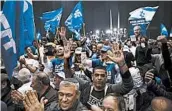  ?? ODED BALILTY/AP ?? Supporters of Israeli Prime Minister Benjamin Netanyahu celebrate after exit poll results were posted Monday.