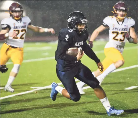  ?? Brian A. Pounds / Hearst Connecticu­t Media ?? Ansonia’s Darrell McKnight returns the opening kickoff for a long gain in the Class S semifinal game against Sheehan in 2019.