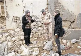  ?? MAYA ALLERUZZO / AP ?? Iraq archaeolog­ist Layla Salih (left) confers with UNESCO’s representa­tive in Iraq, Louise Haxthausen (right), at the ancient site of Nimrud, Iraq. Days after Iraqi forces drove the Islamic State group from Nimrud in November, Salih arrived to survey...